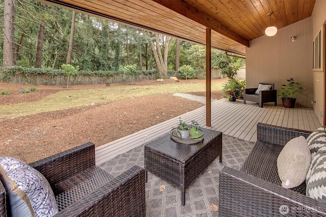 15025 SE 22nd St, Bellevue, WA 98007 - fenced backyard featuring a wooden deck and outdoor lounge area