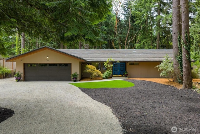 15025 SE 22nd St, Bellevue, WA 98007 - ranch-style house with an attached garage, driveway, and stucco siding