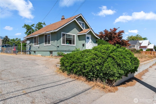 658 Okanogan Ave, Wenatchee, WA 98801 - view of front of property featuring a chimney and roof with shingles
