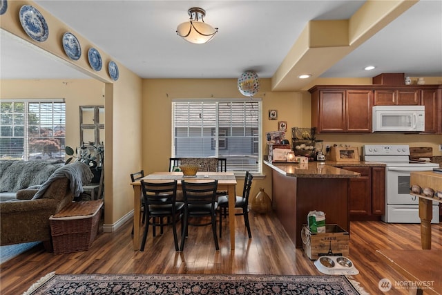 658 Okanogan Ave, Wenatchee, WA 98801 - dining area with dark wood-style flooring and recessed lighting