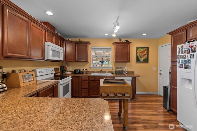 658 Okanogan Ave, Wenatchee, WA 98801 - kitchen featuring white appliances, dark wood-style floors, recessed lighting, and light stone counters