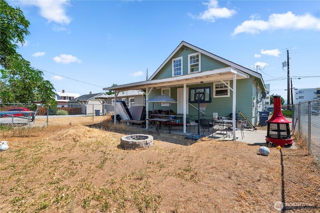 658 Okanogan Ave, Wenatchee, WA 98801 - view of front of house featuring an outdoor fire pit, a fenced backyard, and a patio area