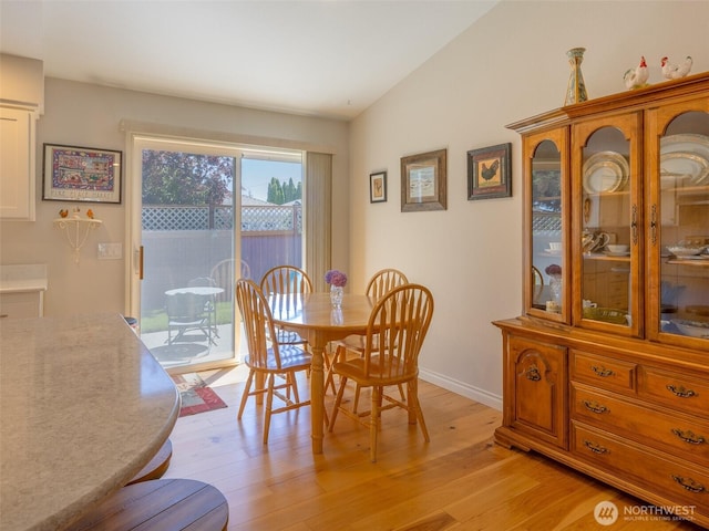 501 Summer Breeze Ln, Sequim, WA 98382 - dining space featuring light wood-style floors and vaulted ceiling