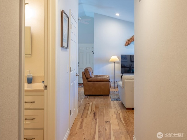 501 Summer Breeze Ln, Sequim, WA 98382 - hallway with light wood-type flooring, vaulted ceiling, and recessed lighting