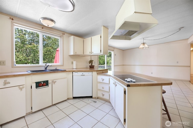 15932 427th Ave SE, Gold Bar, WA 98251 - kitchen with white dishwasher, electric stovetop, exhaust hood, a peninsula, and light tile patterned flooring