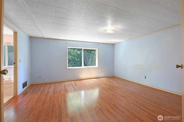 15932 427th Ave SE, Gold Bar, WA 98251 - spare room featuring wood finished floors and a textured ceiling