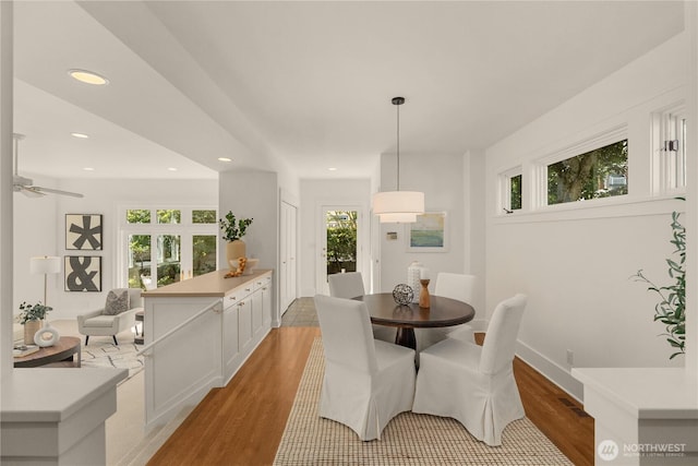 1515 2nd Ave W, Seattle, WA 98119 - dining area featuring light wood finished floors, recessed lighting, and a ceiling fan