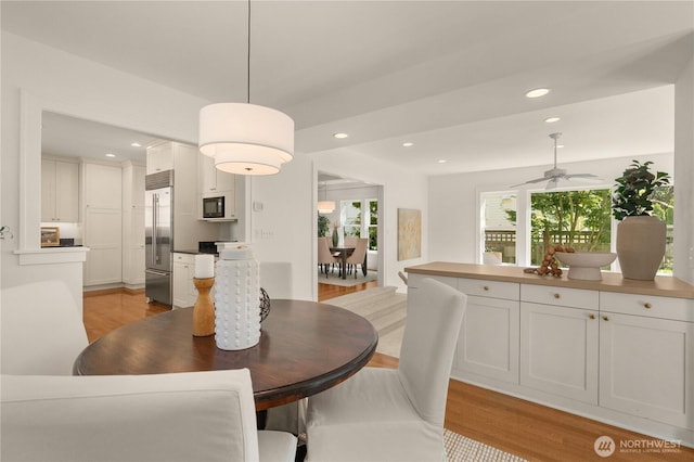 1515 2nd Ave W, Seattle, WA 98119 - dining room with light wood-type flooring, recessed lighting, and ceiling fan