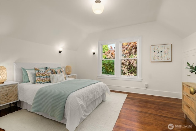 1515 2nd Ave W, Seattle, WA 98119 - bedroom with vaulted ceiling and dark wood-style floors