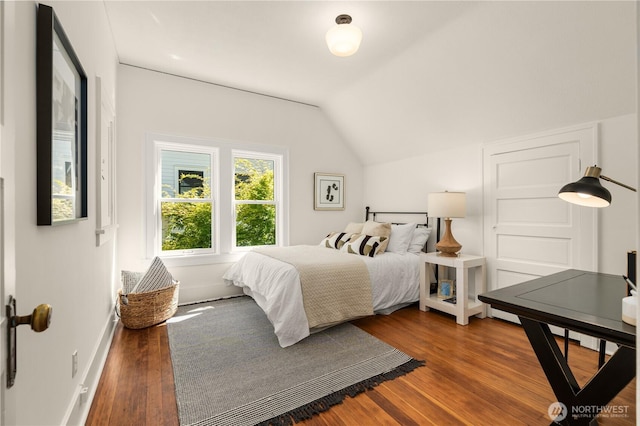 1515 2nd Ave W, Seattle, WA 98119 - bedroom featuring lofted ceiling and wood finished floors