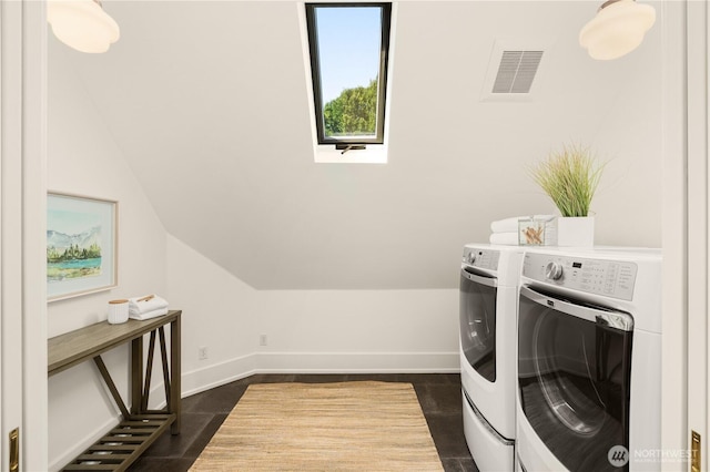 1515 2nd Ave W, Seattle, WA 98119 - laundry area featuring separate washer and dryer and a skylight