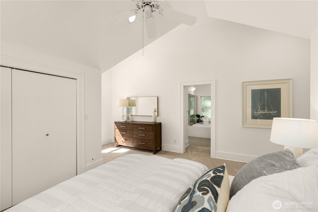 1515 2nd Ave W, Seattle, WA 98119 - bedroom with high vaulted ceiling, light carpet, a closet, a ceiling fan, and ensuite bathroom