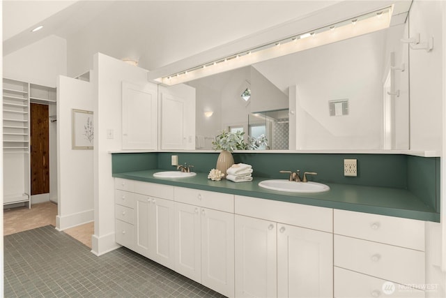 1515 2nd Ave W, Seattle, WA 98119 - full bathroom featuring double vanity, vaulted ceiling, and a shower