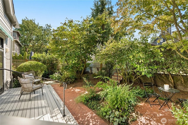 1515 2nd Ave W, Seattle, WA 98119 - deck featuring a patio and a fenced backyard