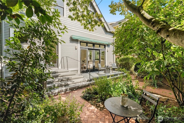 1515 2nd Ave W, Seattle, WA 98119 - back of house featuring french doors and a patio