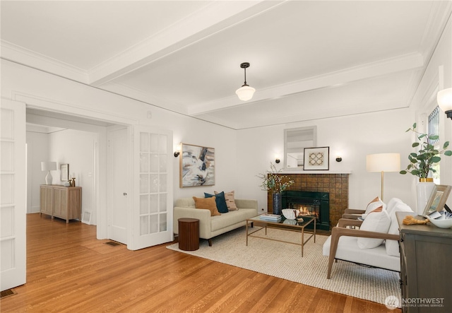 1515 2nd Ave W, Seattle, WA 98119 - living area with light wood-style floors, a fireplace, and beamed ceiling