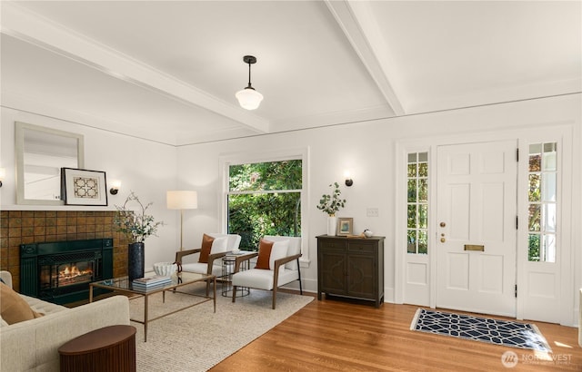 1515 2nd Ave W, Seattle, WA 98119 - foyer entrance with plenty of natural light, wood finished floors, beamed ceiling, and a fireplace