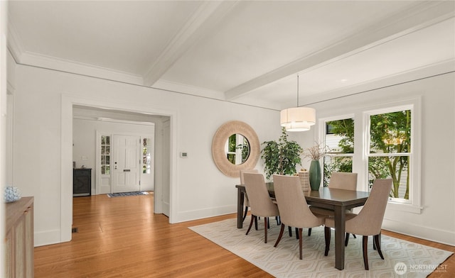 1515 2nd Ave W, Seattle, WA 98119 - dining space with plenty of natural light, light wood finished floors, and beam ceiling