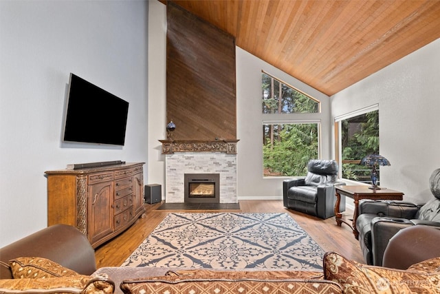 19833 95th Ave NE, Bothell, WA 98011 - living room featuring wood ceiling, a tile fireplace, light wood-style flooring, and high vaulted ceiling