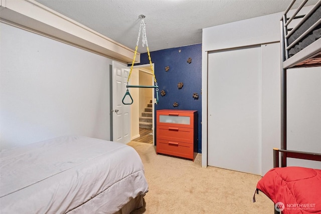 19833 95th Ave NE, Bothell, WA 98011 - bedroom with light colored carpet, a closet, and a textured ceiling