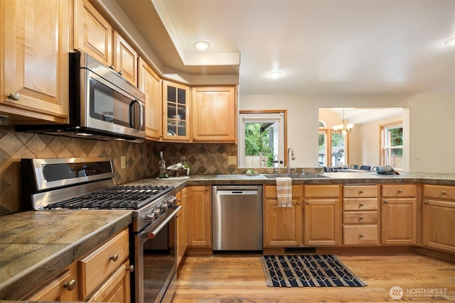 3120 Tanglewood Ln, Bellingham, WA 98226 - kitchen with stainless steel appliances, a chandelier, healthy amount of natural light, light wood-style floors, and recessed lighting