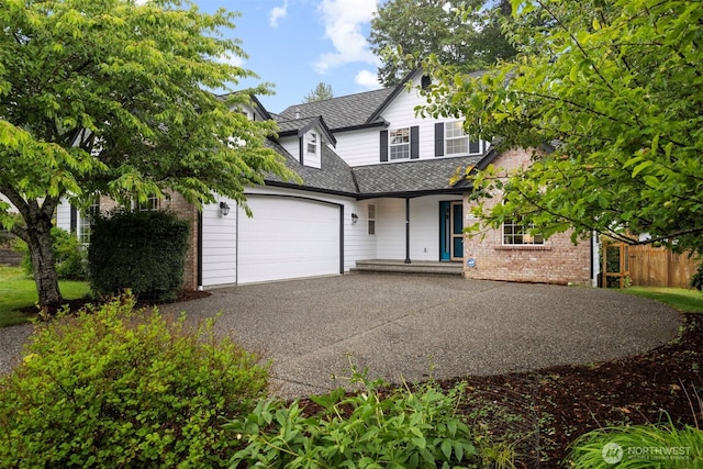 3120 Tanglewood Ln, Bellingham, WA 98226 - traditional-style home with concrete driveway, a garage, a shingled roof, and brick siding