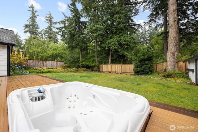 3120 Tanglewood Ln, Bellingham, WA 98226 - deck with a fenced backyard, an outdoor hot tub, and view of wooded area