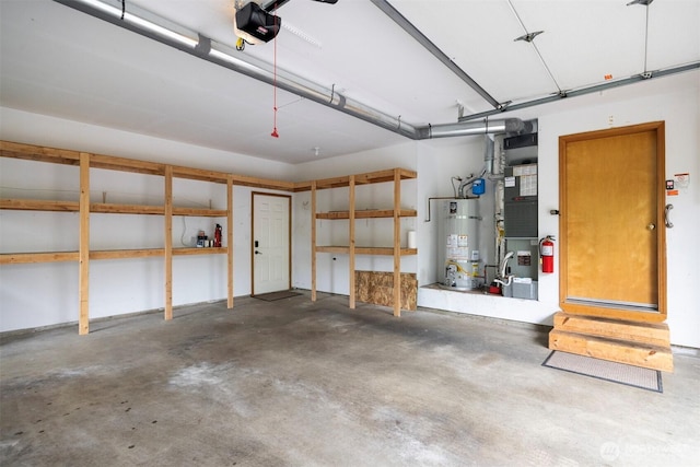3120 Tanglewood Ln, Bellingham, WA 98226 - garage with secured water heater and a garage door opener