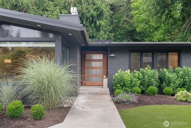 23406 Humber Ln, Edmonds, WA 98020 - property entrance featuring brick siding and a chimney