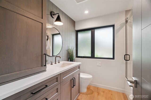 23406 Humber Ln, Edmonds, WA 98020 - bathroom featuring vanity, wood finished floors, recessed lighting, and a shower