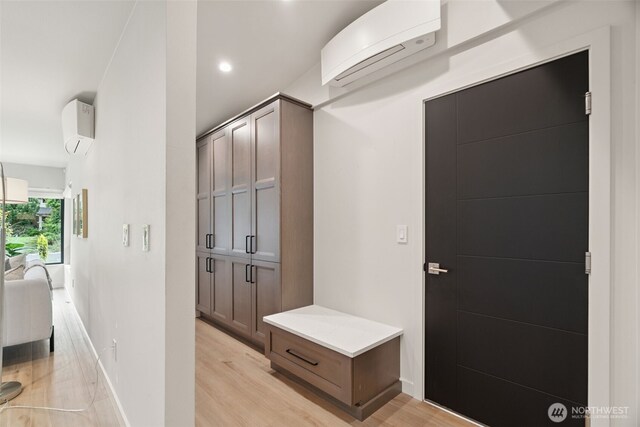 23406 Humber Ln, Edmonds, WA 98020 - mudroom with a wall mounted air conditioner, light wood-style floors, and recessed lighting