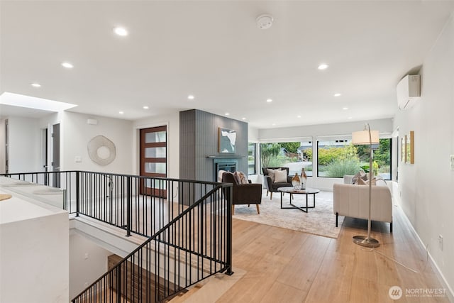 23406 Humber Ln, Edmonds, WA 98020 - hall featuring recessed lighting, light wood-style floors, an upstairs landing, and a wall unit AC