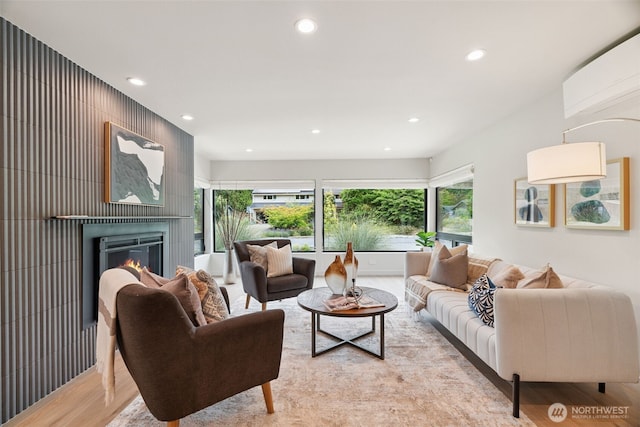 23406 Humber Ln, Edmonds, WA 98020 - living area featuring light wood-style flooring, recessed lighting, and a glass covered fireplace