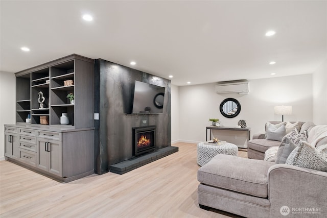 23406 Humber Ln, Edmonds, WA 98020 - living area with light wood-style floors, recessed lighting, a wall mounted AC, and a large fireplace