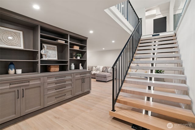23406 Humber Ln, Edmonds, WA 98020 - stairs featuring wood finished floors, a wall unit AC, and recessed lighting