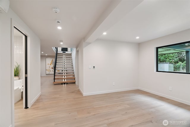 23406 Humber Ln, Edmonds, WA 98020 - unfurnished room featuring a smoke detector, stairway, light wood-type flooring, recessed lighting, and a wall unit AC