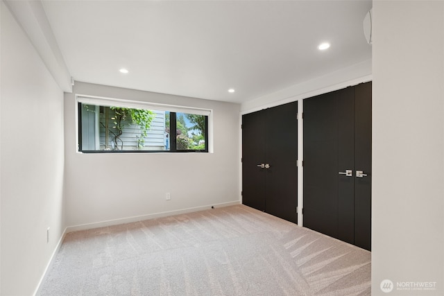 23406 Humber Ln, Edmonds, WA 98020 - unfurnished bedroom with carpet floors, recessed lighting, and two closets