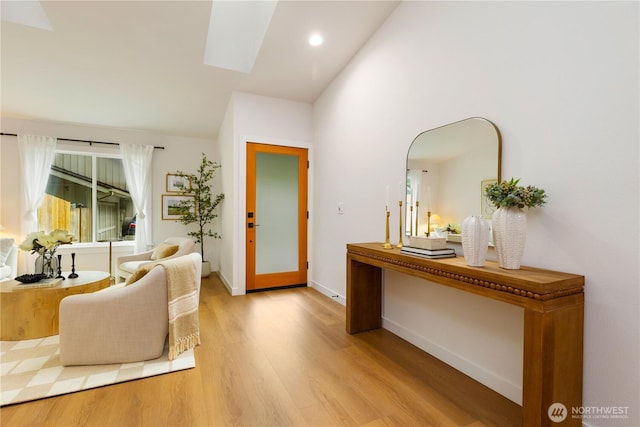14703 121st Ct NE, Kirkland, WA 98034 - living area featuring light wood-type flooring, a skylight, recessed lighting, and high vaulted ceiling