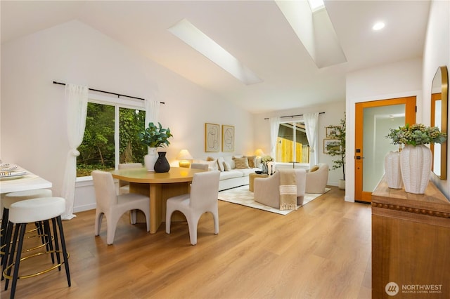 14703 121st Ct NE, Kirkland, WA 98034 - dining space with lofted ceiling, light wood-style flooring, a skylight, and recessed lighting