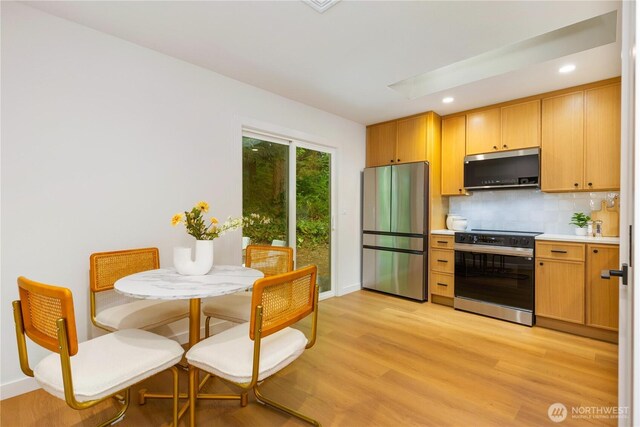 14703 121st Ct NE, Kirkland, WA 98034 - kitchen featuring stainless steel appliances, backsplash, light countertops, light wood-type flooring, and recessed lighting