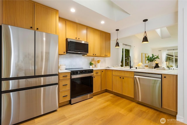 14703 121st Ct NE, Kirkland, WA 98034 - kitchen featuring stainless steel appliances, light wood-type flooring, light countertops, tasteful backsplash, and pendant lighting