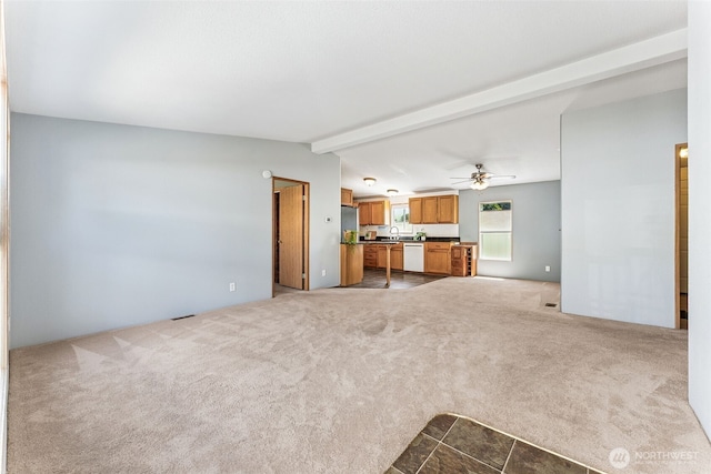 10900 Kuhlmann Rd SE Unit 50, Olympia, WA 98513 - unfurnished living room featuring a ceiling fan and carpet