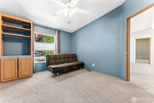 10900 Kuhlmann Rd SE Unit 50, Olympia, WA 98513 - sitting room featuring light carpet, ceiling fan, and lofted ceiling