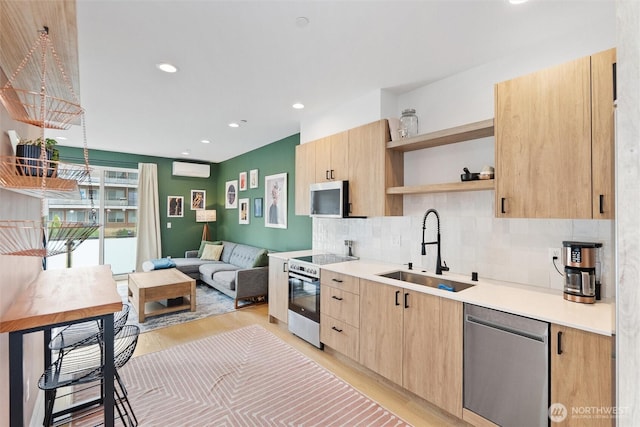 8455 Delridge Way SW, Seattle, WA 98106 - kitchen with stainless steel appliances, light brown cabinets, open shelves, light wood-type flooring, and light countertops