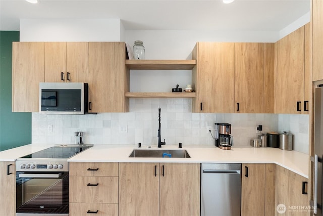 8455 Delridge Way SW, Seattle, WA 98106 - kitchen featuring stainless steel appliances, light brown cabinetry, tasteful backsplash, open shelves, and light countertops