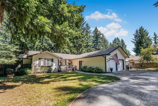 15922 Lindsay Rd SE, Yelm, WA 98597 - ranch-style home with driveway, a garage, and covered porch