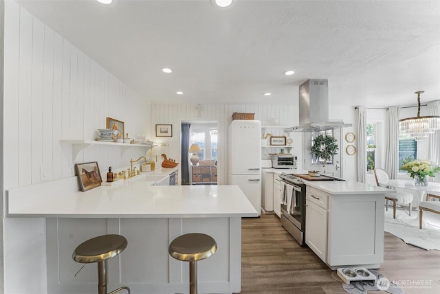 15922 Lindsay Rd SE, Yelm, WA 98597 - kitchen with range hood, open shelves, stainless steel electric range oven, freestanding refrigerator, and recessed lighting