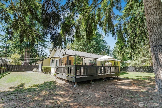 15922 Lindsay Rd SE, Yelm, WA 98597 - rear view of house featuring a fenced backyard and a deck
