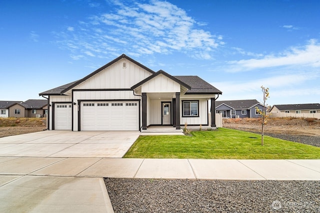 5738 S Zabo Rd, Spokane, WA 99224 - modern inspired farmhouse featuring a garage, a front yard, concrete driveway, and board and batten siding