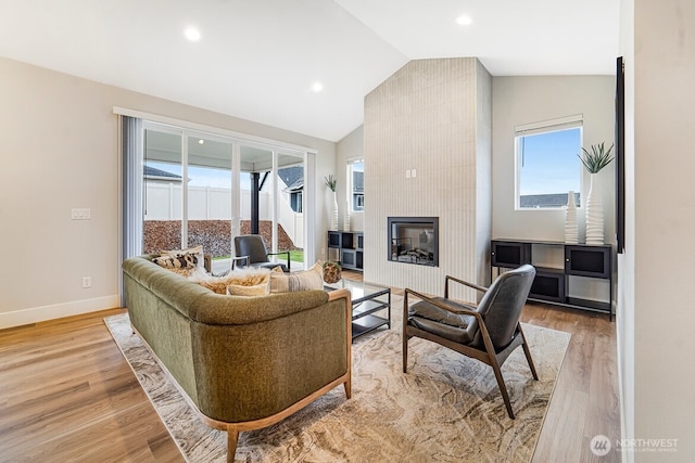 5738 S Zabo Rd, Spokane, WA 99224 - living room with vaulted ceiling, light wood-style floors, healthy amount of natural light, a fireplace, and recessed lighting